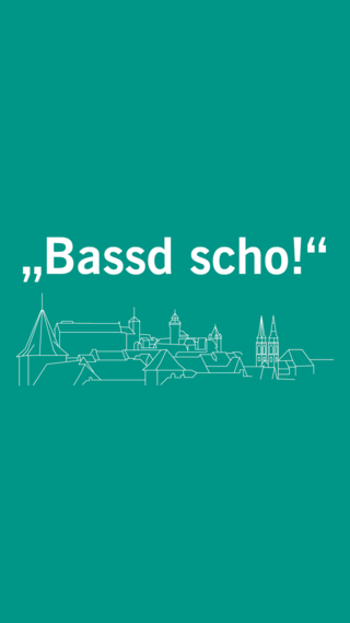 das Wort "Bassd Scho" und Nürnberger Skyline in weiß auf smaragdgrün